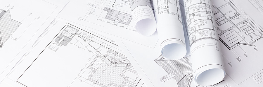 Some CAD drawings on a table