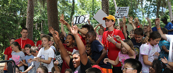 A lot of excited kids cheering